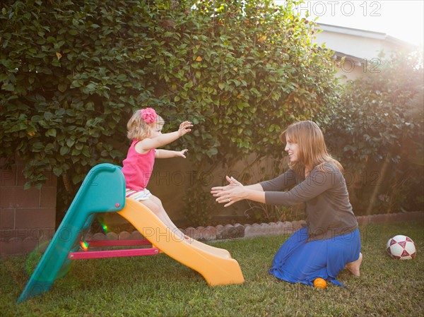 Mother and her daughter playing in backyard. Photo: Jessica Peterson