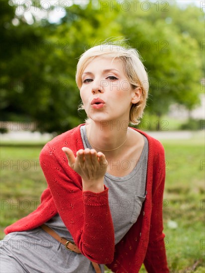 Portrait of woman blowing kiss. Photo : Jessica Peterson