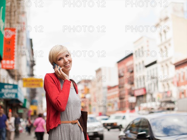 Woman smiling and talking on phone. Photo : Jessica Peterson