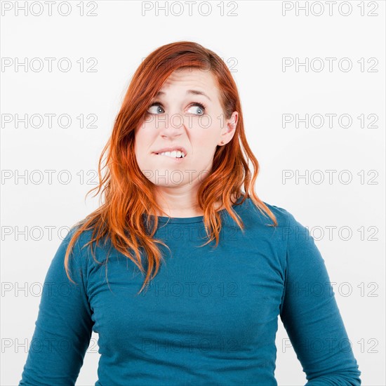 Studio shot, Portrait of woman being surprised. Photo : Jessica Peterson