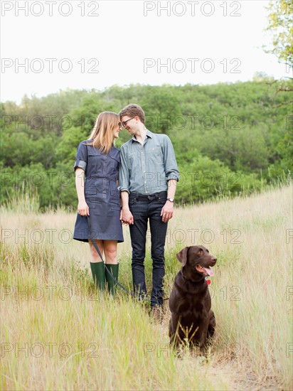 Portrait of young couple with dog. Photo: Jessica Peterson