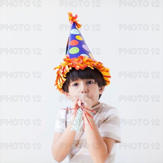 Studio Shot of young boy with hat on his head. Photo: Jessica Peterson