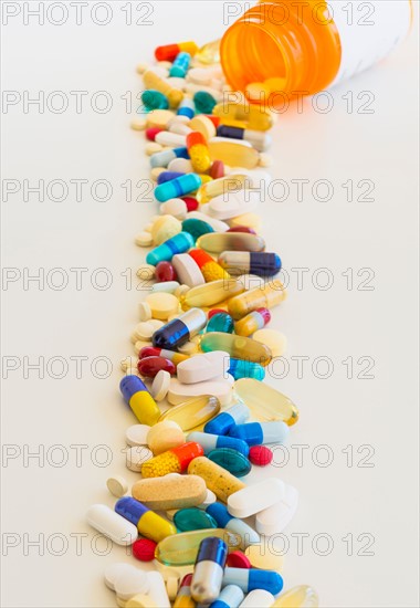 Colorful pills on white background.