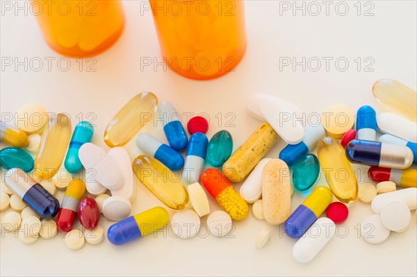 Colorful pills on white background.