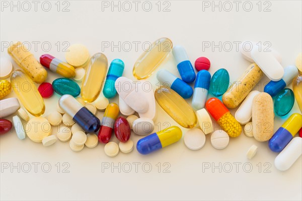 Colorful pills on white background.