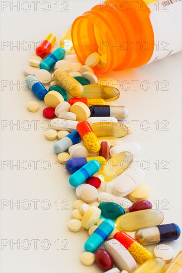 Colorful pills on white background.