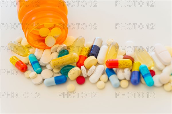 Colorful pills on white background.