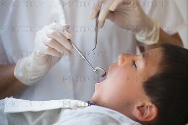 Boy (6-7) at dentist's.