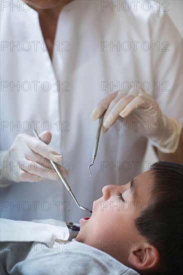 Boy (6-7) at dentist's.