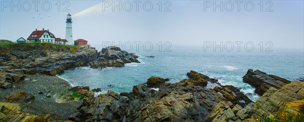 Remote coastline with lighthouse. Portland, Maine.