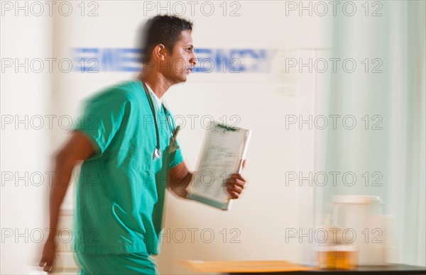 Surgeon entering emergency room.