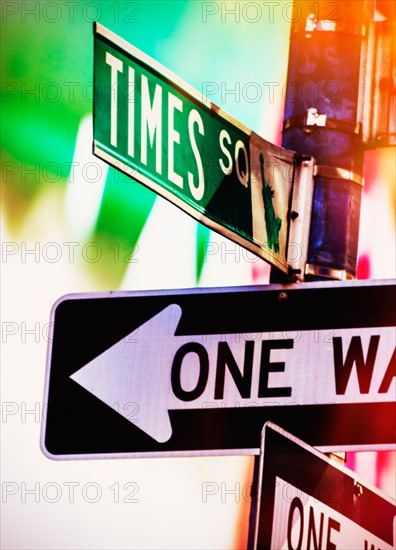 Directional signs at night. New York City, New York.