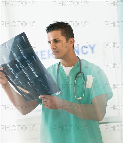 Doctor looking at x-ray image.