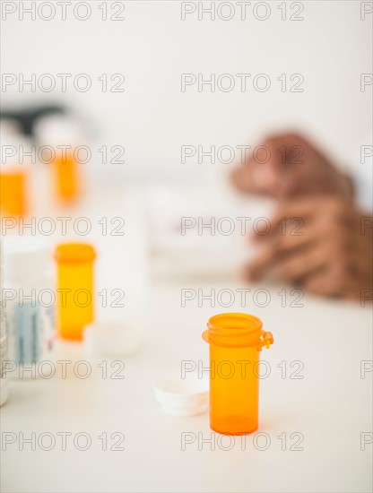 Pharmacist preparing prescription pills.
