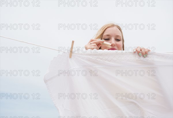 Young woman doing laundry