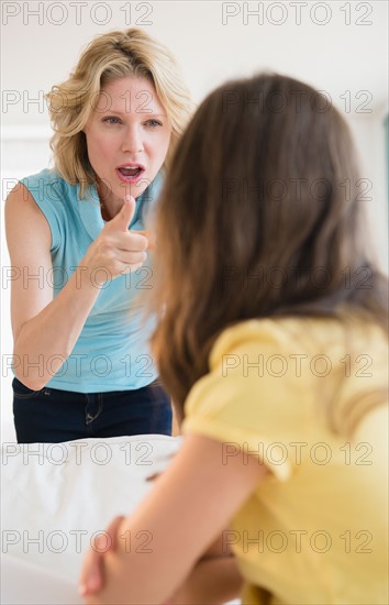 Mother and daughter (8-9 years) arguing