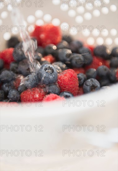 Studio shot of berries on colander