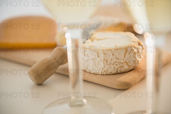 Studio shot of cheese on chopping board