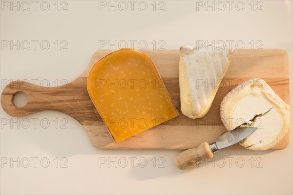 Studio shot of cheese on chopping board