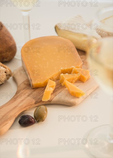 Studio shot of cheese on chopping board