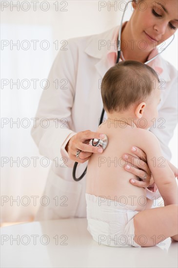 Doctor and baby girl (6-11 months)
