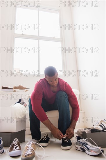 Young man in shoes store