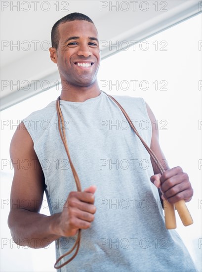 Young man with skipping rope