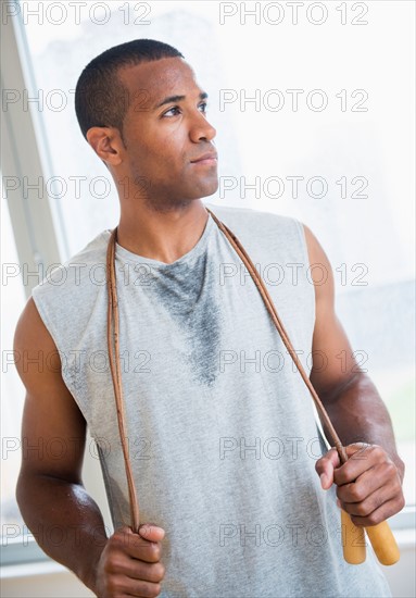 Young man with skipping rope