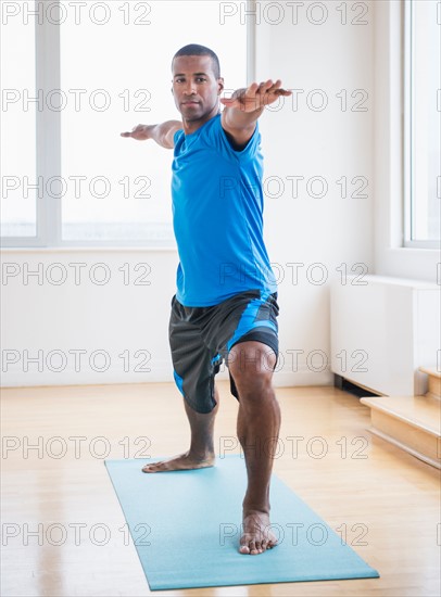 Young man practicing yoga