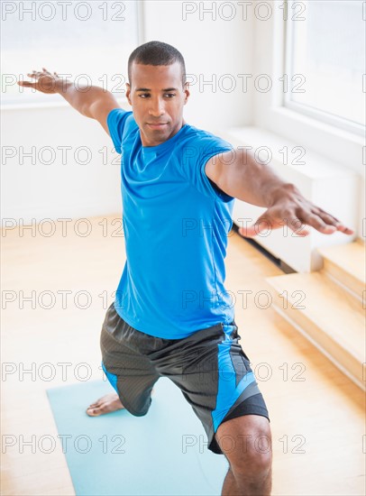 Young man practicing yoga