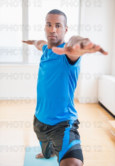 Young man practicing yoga