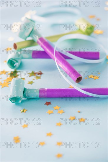 Studio shot of party blowers and confetti