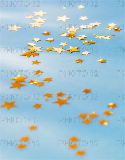 Studio shot of confetti spilled on table