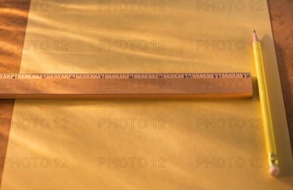Elevated view of ruler, pencil and paper sheet