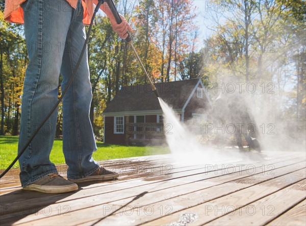 Man cleaning porch