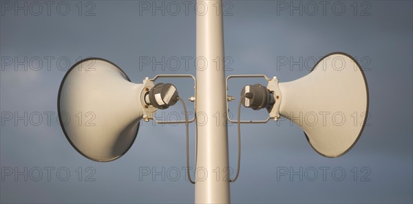 Megaphone against grey sky