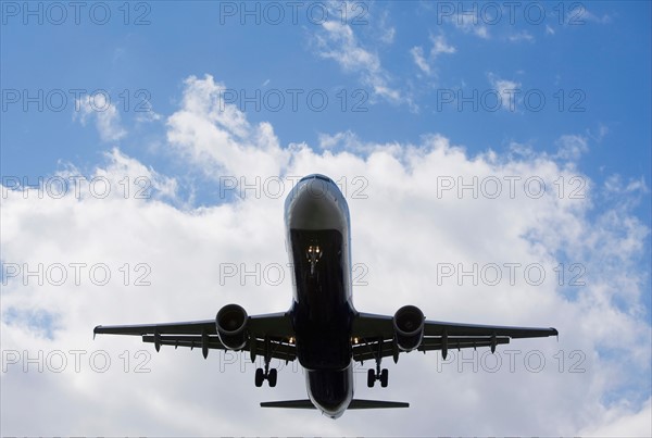 Low angle view of flying airplane