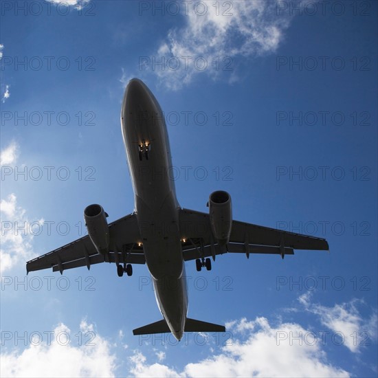 Low angle view of flying airplane