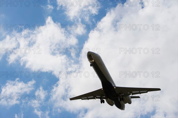 Low angle view of flying airplane