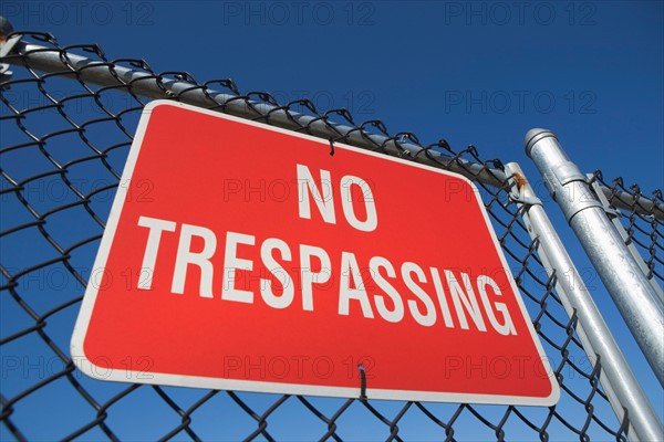 Low angle view of no trespassing sign