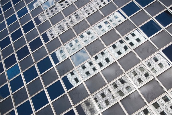 Chrysler building reflecting in glass building