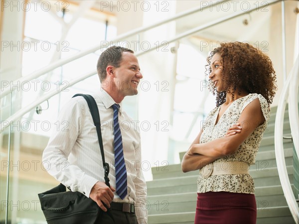 Portrait of man and woman looking at each other