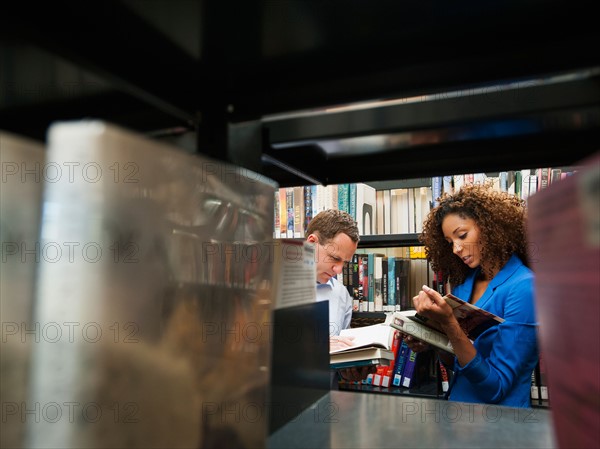 Man and woman researching library