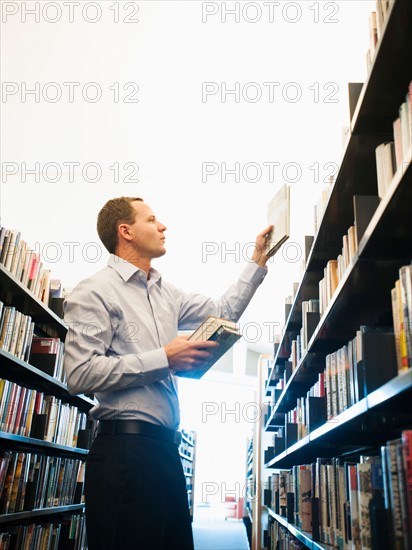 View of man researching library