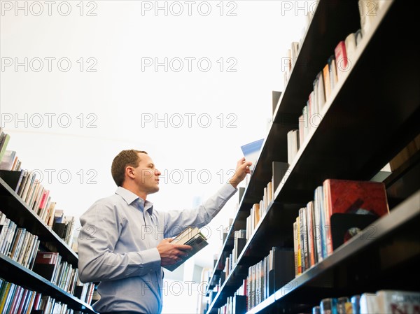 View of man researching library