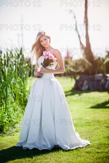 Portrait of bride holding bouquet