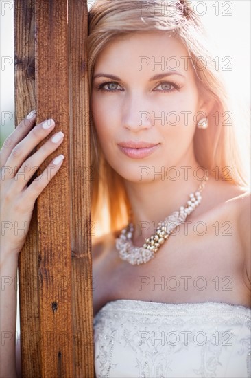 Portrait of bride posing outdoors