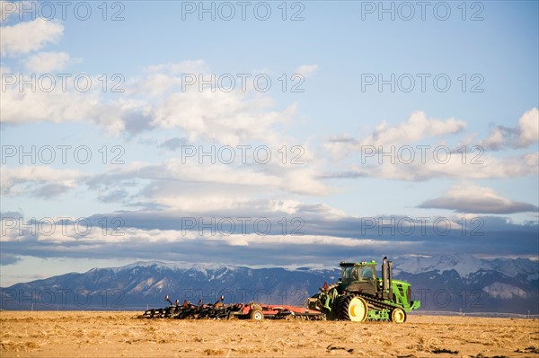 Tractor tilling field