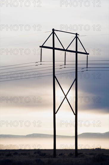 Power lines and tower at sunset
