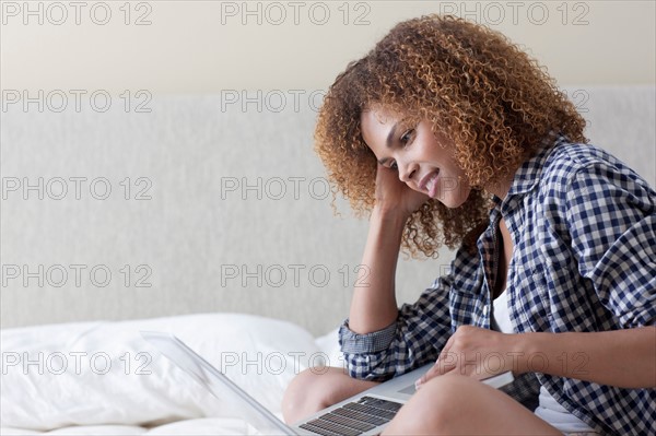 Mid adult woman relaxing at home